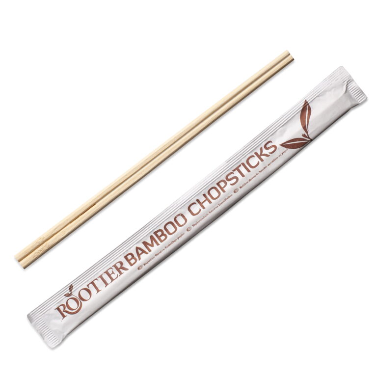 Pair of wooden chopsticks beside a paper wrapper labelled “ROOTER BAMBOO CHOPSTICKS”