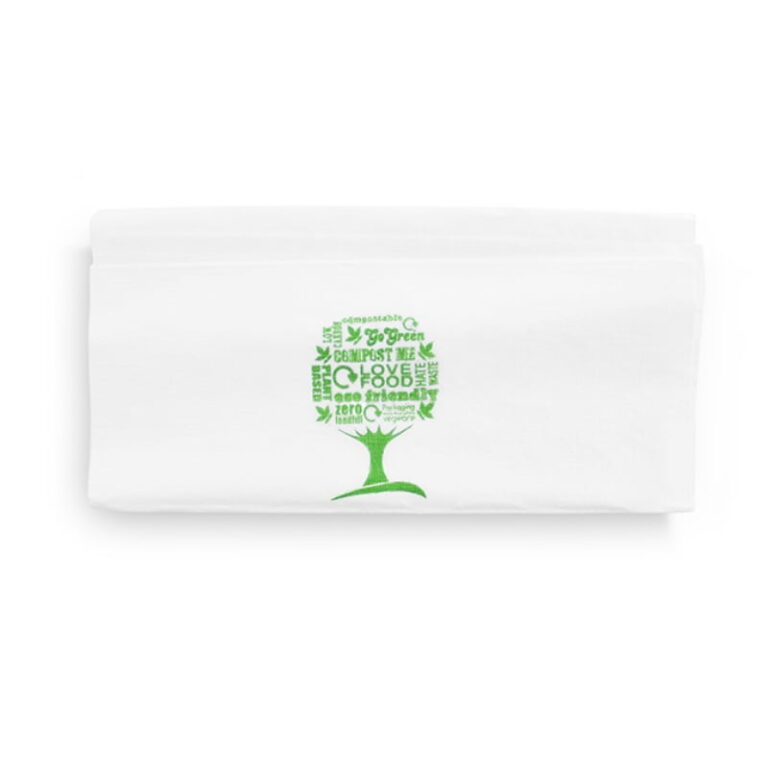 White folded dispenser napkin printed with a green tree and sustainability message