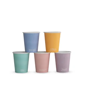 Five colourful compostable single-wall hot cups arranged together, each featuring a different feel-good message.