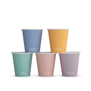 Five colourful single-wall takeaway hot cups stacked together, each with a small feel-good message.