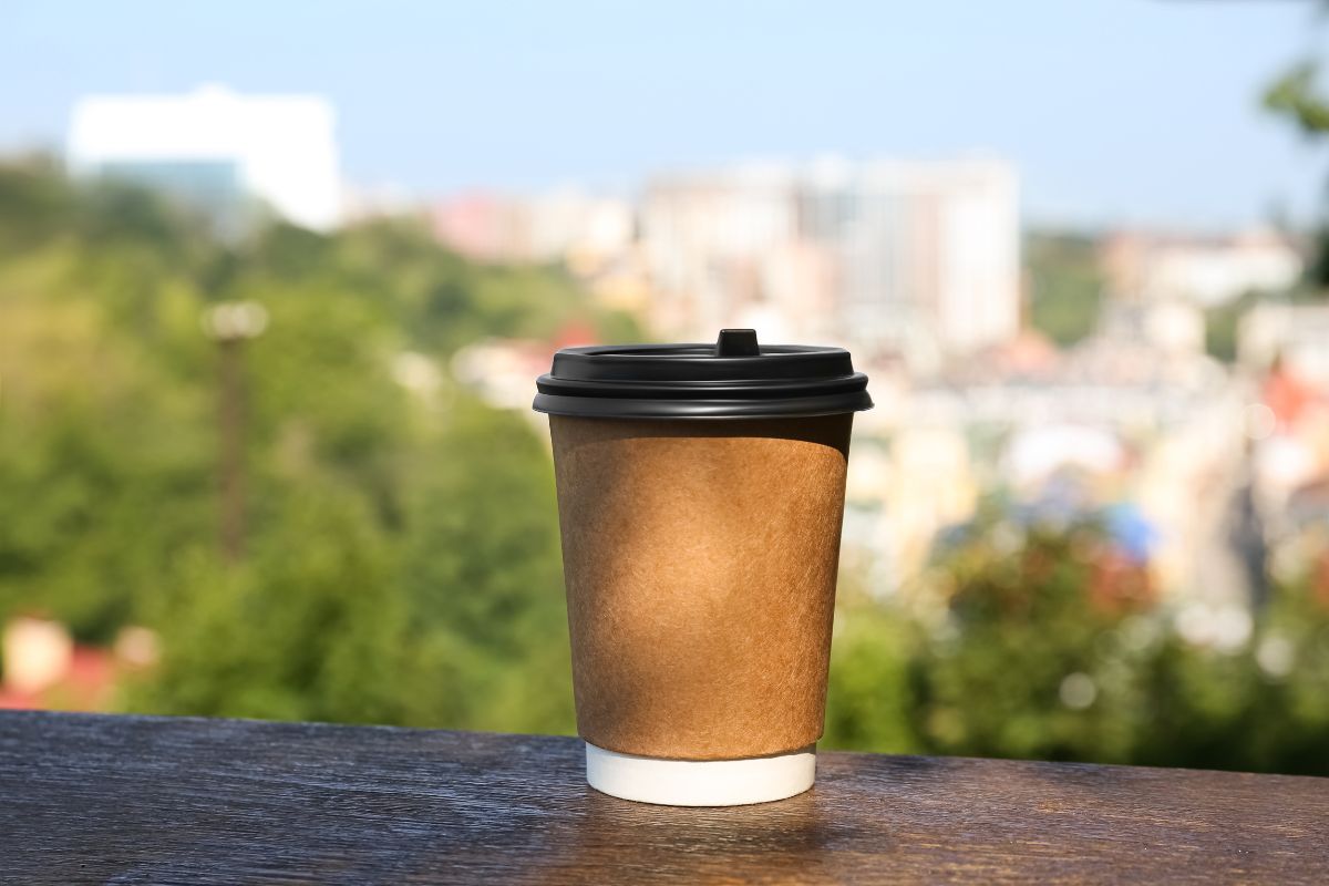 Takeaway cup overlooking city