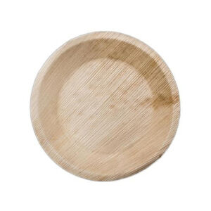 Empty 6-inch round palm leaf plate on a white background