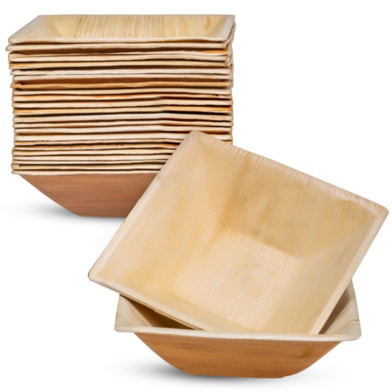 Stack of square 7-inch palm leaf bowls with two bowls in front
