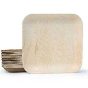 9-inch square palm leaf plate with a stack behind